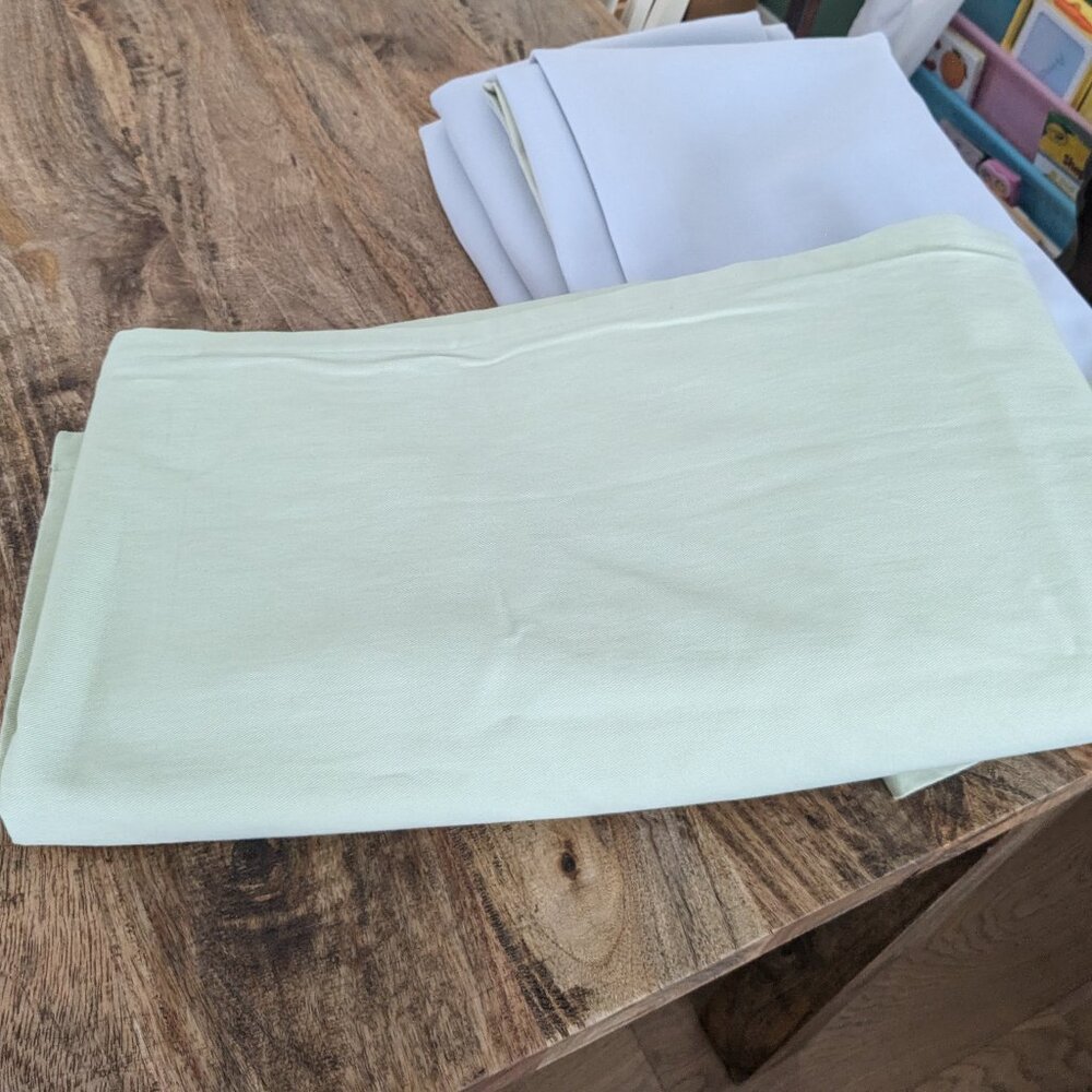Set of four (4) Pottery Barn Kids light green blackout curtain panels